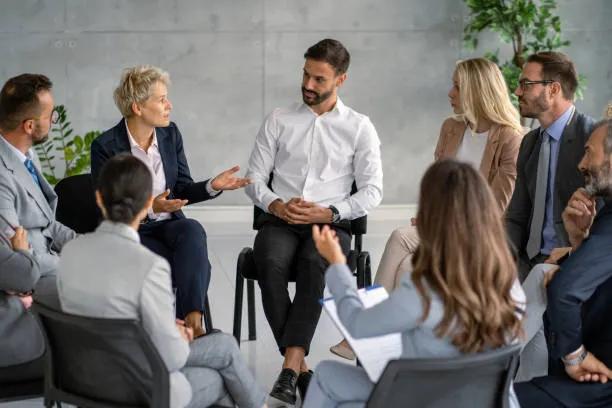 Corporate event management team reviewing event performance, ROI metrics and lessons learned