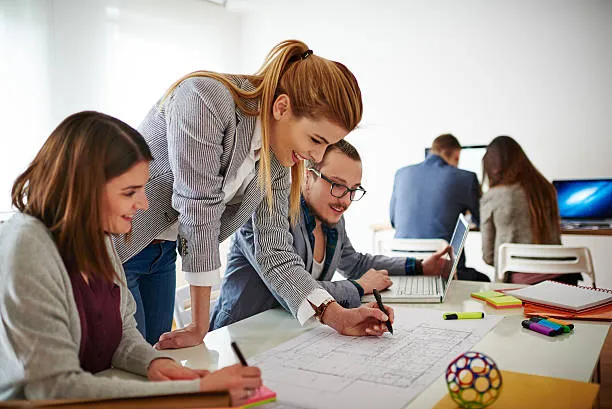 Corporate event team reviewing post-event ROI data, attendance, budget and performance metrics